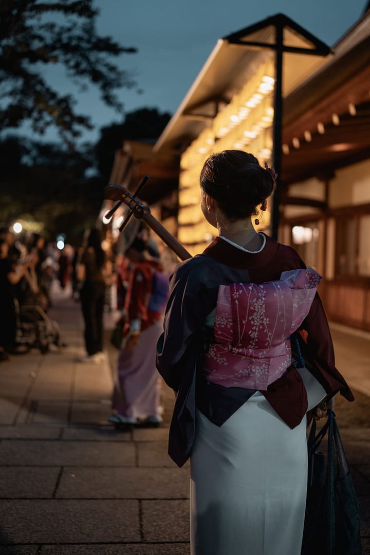 A woman who have a japanese instrument during Mitama festival in Yasukuni Jinja